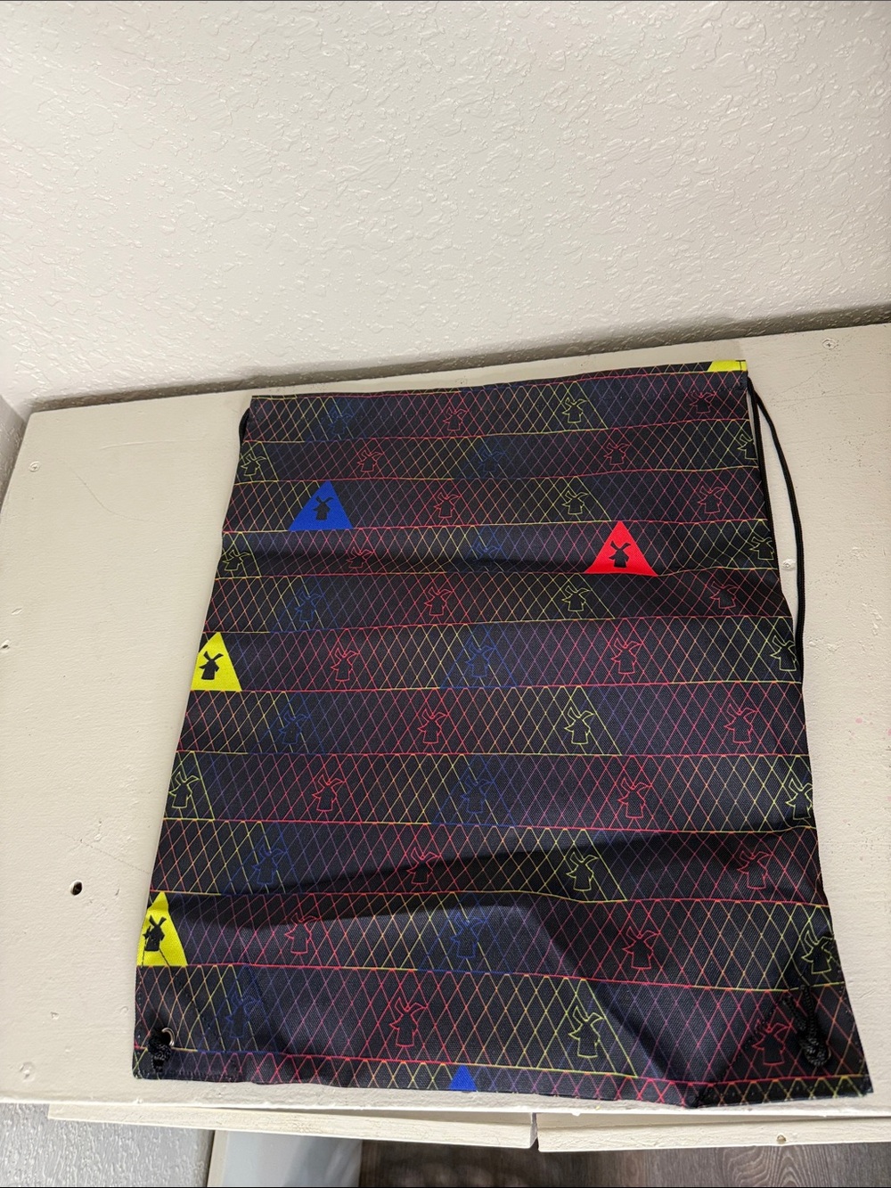 Dutch bros Coacha Black drawstring bag 
with Neon Triangle Accents